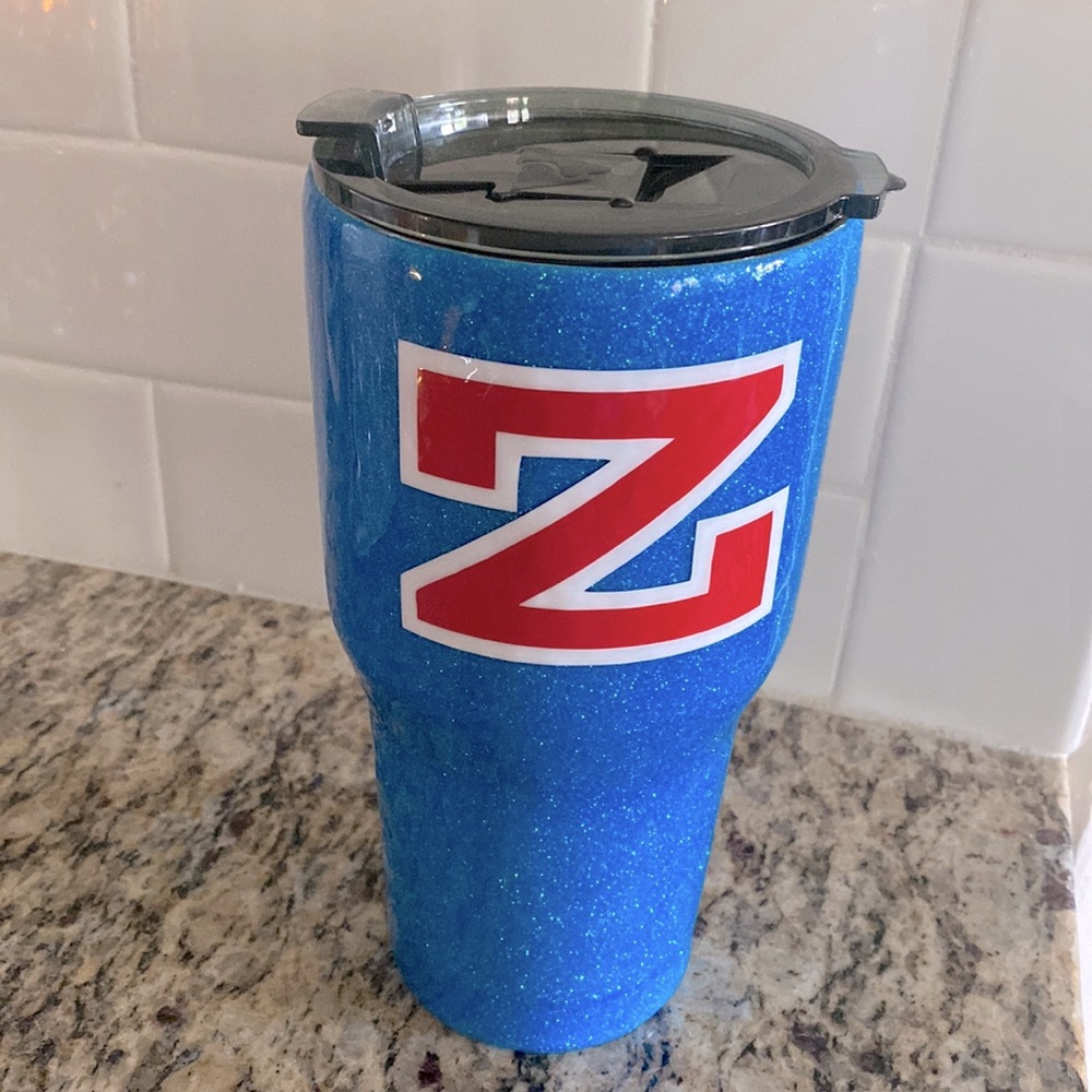“Z” insulated tumbler in sparkly blue with a red and white Z